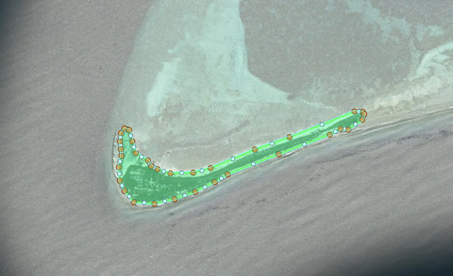 Aerial view of a resort with a geofenced safety zone overlay around the pools and beach